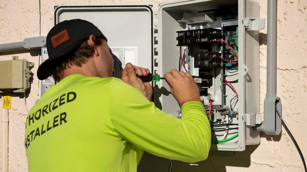Electrician working on an electrical panel